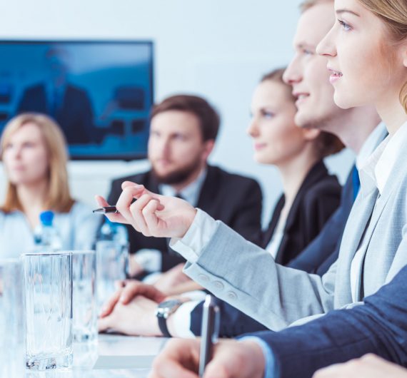 Young lawyer discussing company strategy during video conference